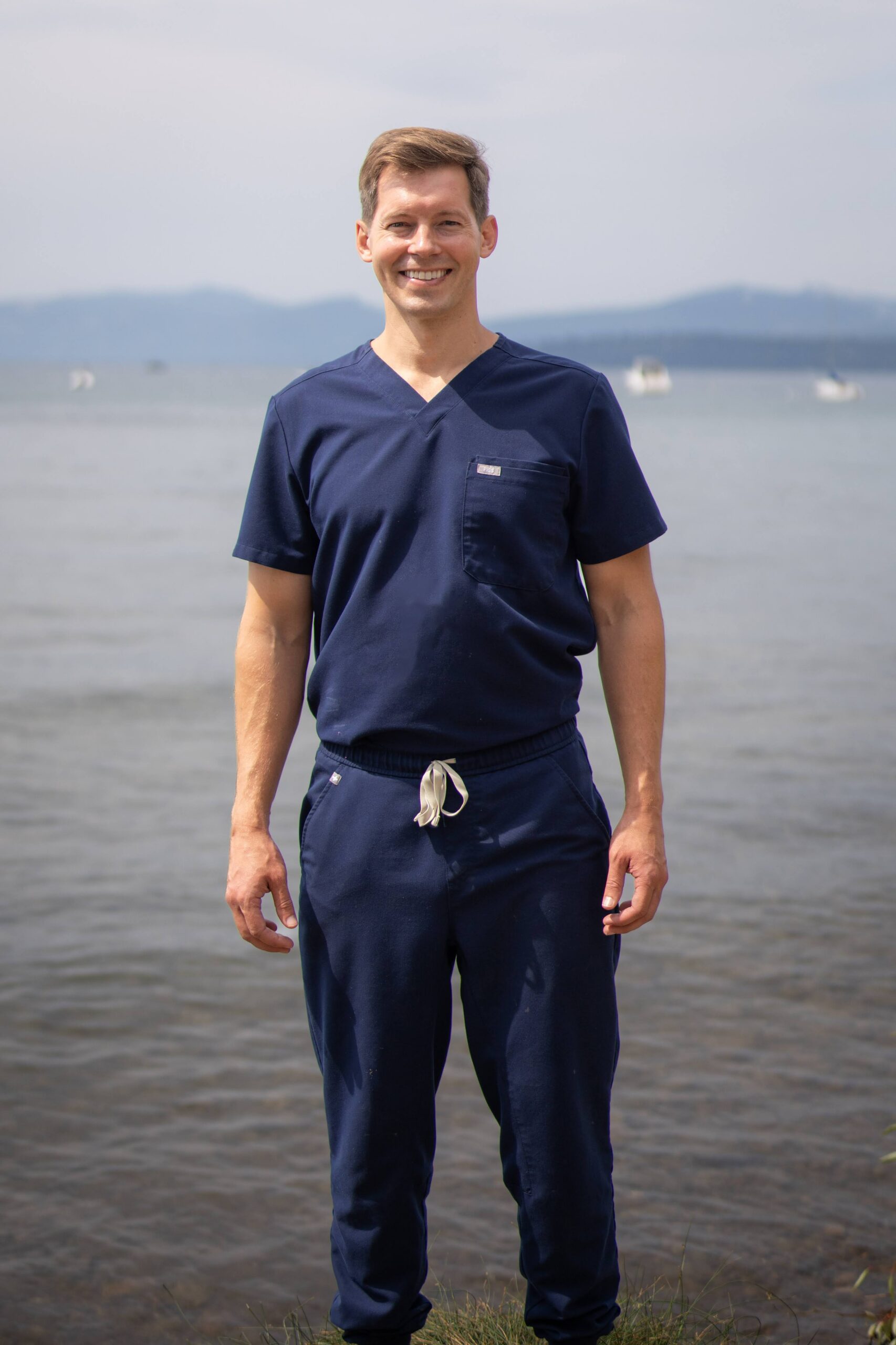 Dr. Shimp in clinical scrubs